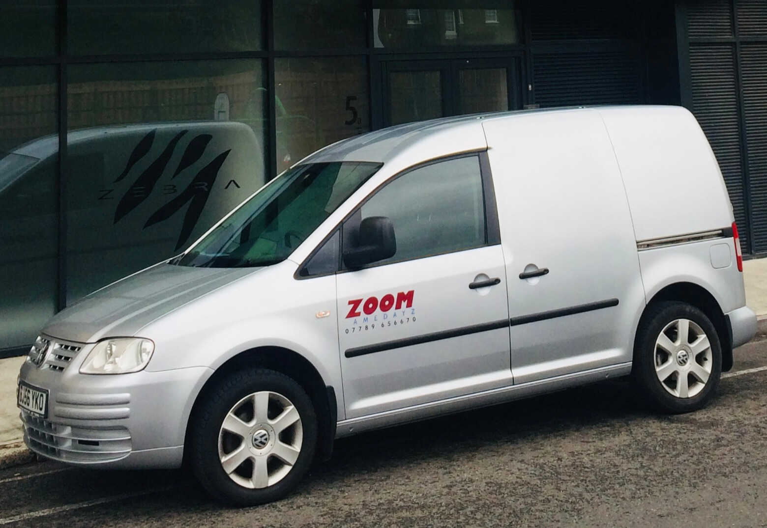 Photo of delivery van outside a building